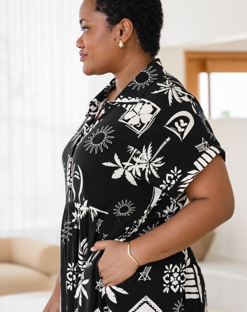 Woman wearing a black and white patterned shirt indoors