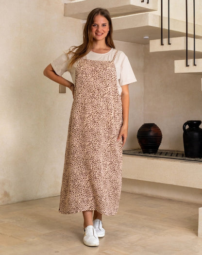 Woman wearing a floral dress in a modern kitchen setting